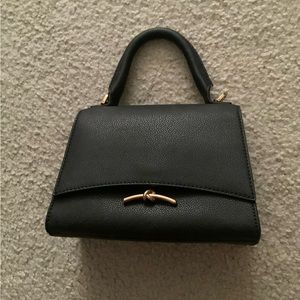 Black Huxley Push Lock Bag